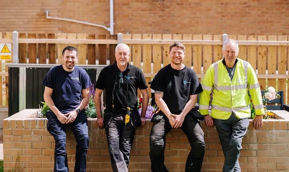 SolShare Allume's partners, social housing, building company and installers at a UK residential site, working together to deliver clean, affordable energy to social housing and private development tenants.