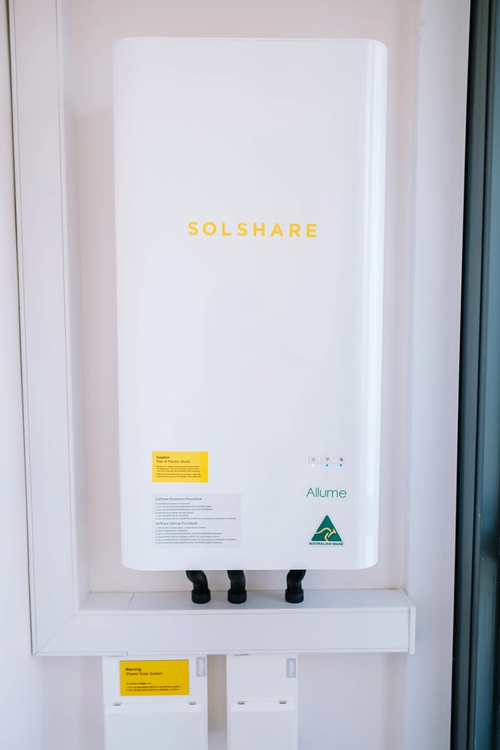 A world-first Allume SolShare hardware unit installed in a real-world setting to enable shared rooftop solar for multi-dwelling residents.
