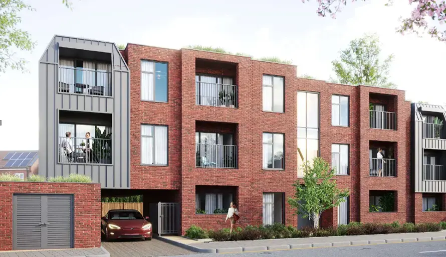 A new build installation project by MKM Developments featuring Allume’s SolShare technology. The image shows a modern red-brick apartment building designed for shared solar energy distribution among multiple residents.